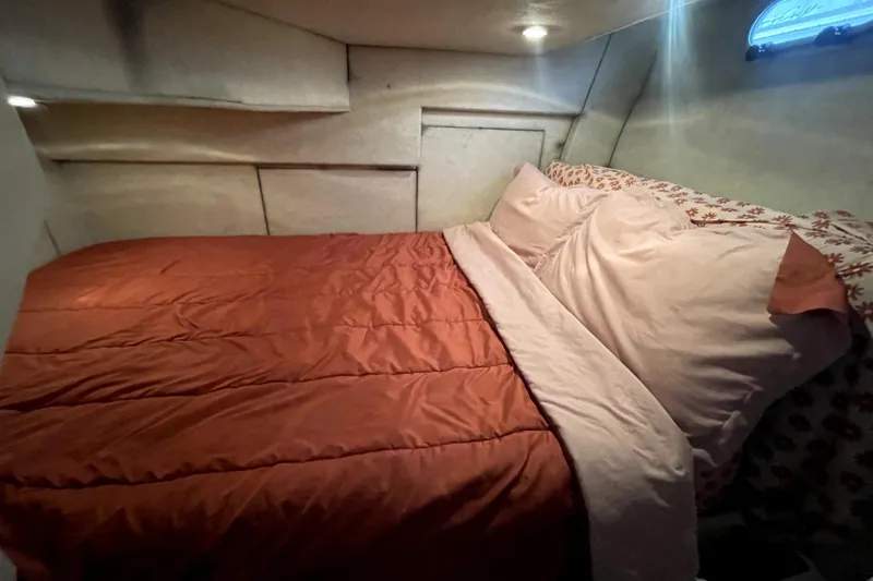 Slide: The Image of Cozy bedroom in 2001 Bayliner 3988 Command Bridge Motoryacht with red bedding. - 16