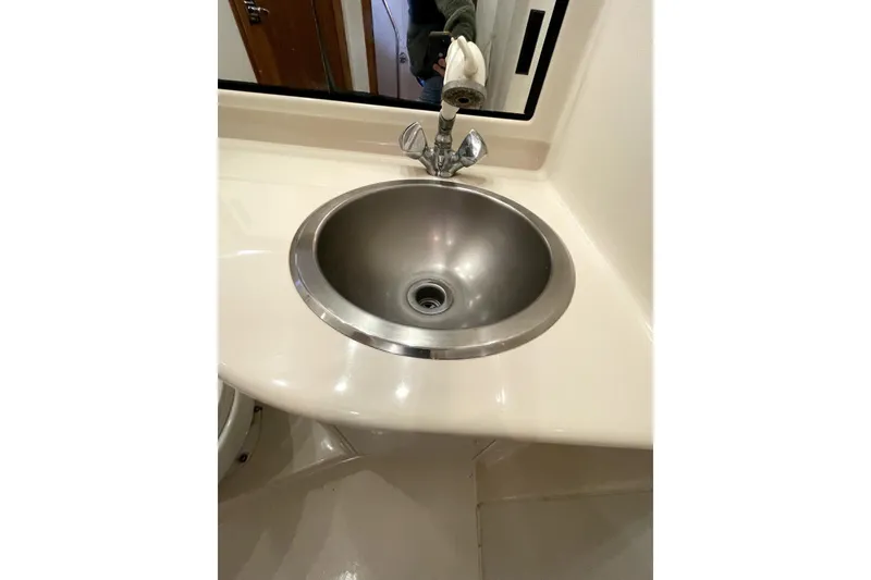 Slide: The Image of Stainless steel sink in 2001 Bayliner 3988 Command Bridge Motoryacht bathroom. - 26