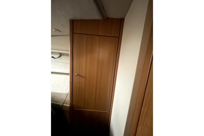 Slide: The Image of Interior view of 2001 Bayliner 3988 Command Bridge Motoryacht with wooden cabinetry. - 29