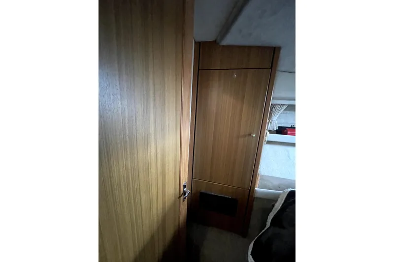 Slide: The Image of Interior of 2001 Bayliner 3988 Command Bridge Motoryacht with wooden cabinetry and cozy design. - 30