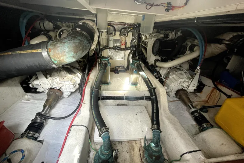 Slide: The Image of Engine room of 2001 Bayliner 3988 Command Bridge Motoryacht, showcasing mechanical components. - 43