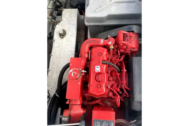 Slide: The Image of Engine of 2001 Bayliner 3988 Command Bridge Motoryacht, painted in bright red. - 48