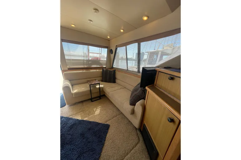 Slide: The Image of Luxurious interior of 2001 Bayliner 3988 Command Bridge Motoryacht with plush seating and elegant decor. - 7