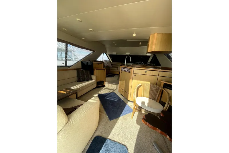 Slide: The Image of Interior of 2001 Bayliner 3988 Command Bridge Motoryacht with cozy seating and modern amenities. - 8