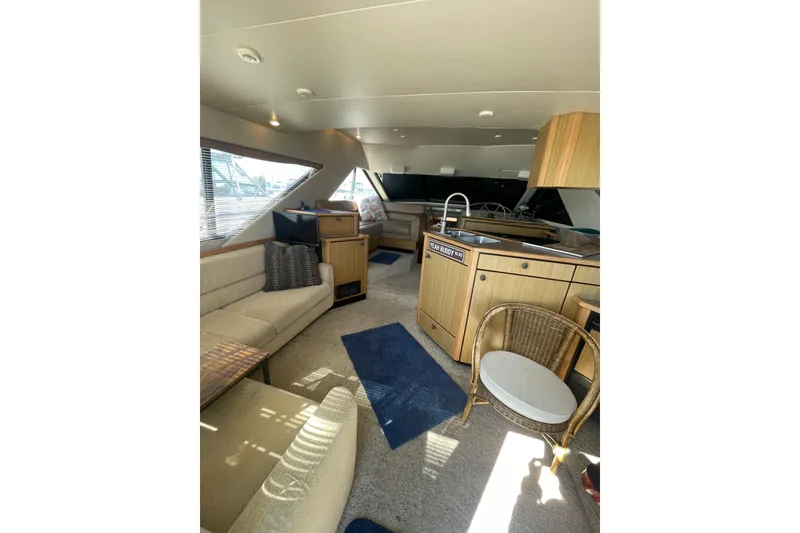 Slide: The Image of Interior of 2001 Bayliner 3988 Command Bridge Motoryacht with cozy seating and modern kitchen. - 9