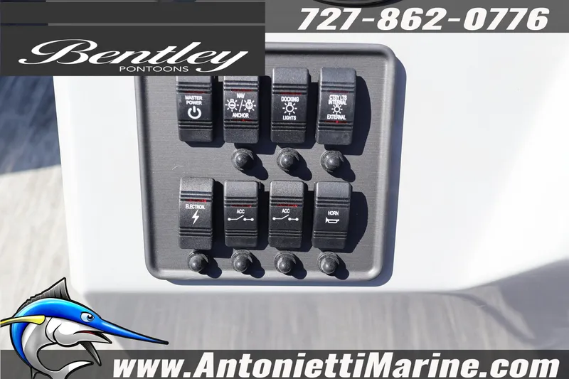 Slide: The Image of Control panel of 2026 Bentley Pontoons Bolt 223 with various switches and branding. - 23