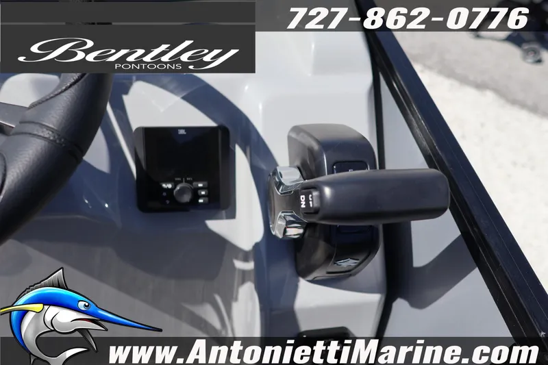 Slide: The Image of 2026 Bentley Pontoons Bolt 223 steering console with controls and branding. - 25