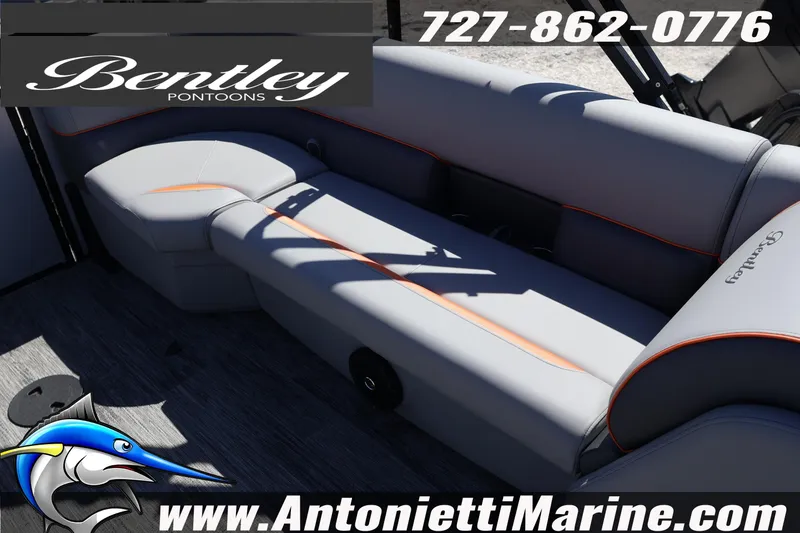 Slide: The Image of 2026 Bentley Pontoons Bolt 223 interior with gray seating and orange accents. - 26