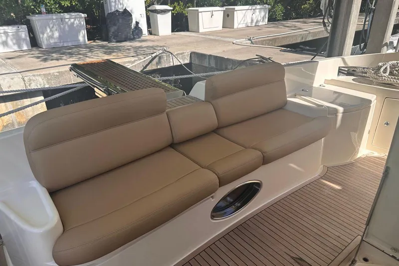 Slide: The Image of Luxury seating on 2007 Azimut 55E yacht, docked with beige cushions. - 15
