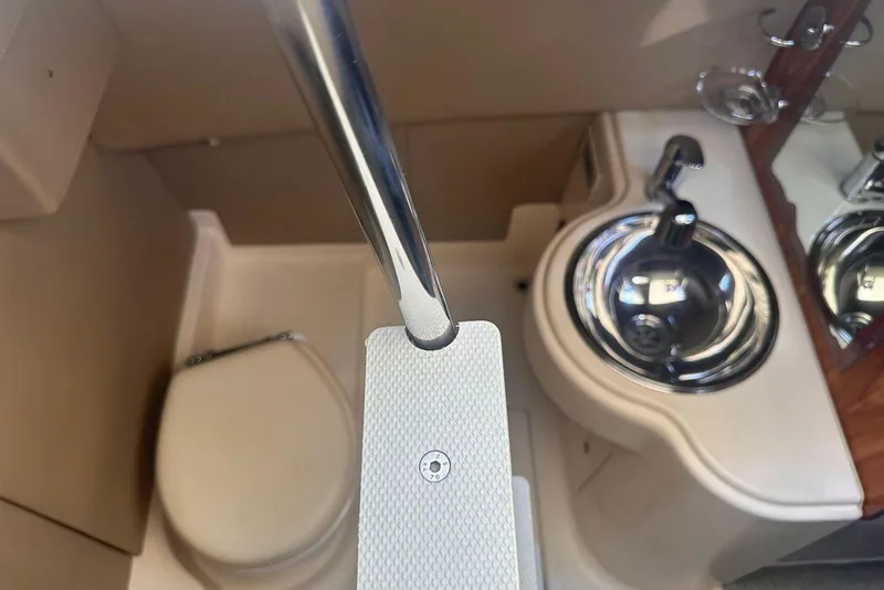 Slide: The Image of 2007 Azimut 55E yacht bathroom with toilet and stainless steel sink. - 18