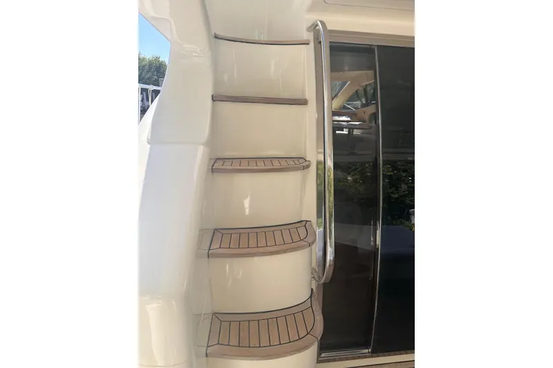 Slide: The Image of Staircase on 2007 Azimut 55E yacht with wooden steps and metal railing. - 39