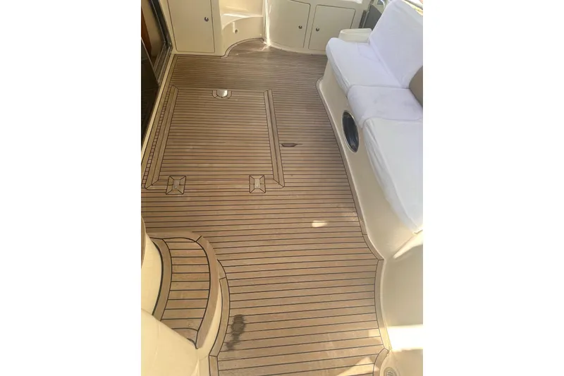 Slide: The Image of 2007 Azimut 55E yacht interior with elegant wooden flooring and comfortable seating. - 40