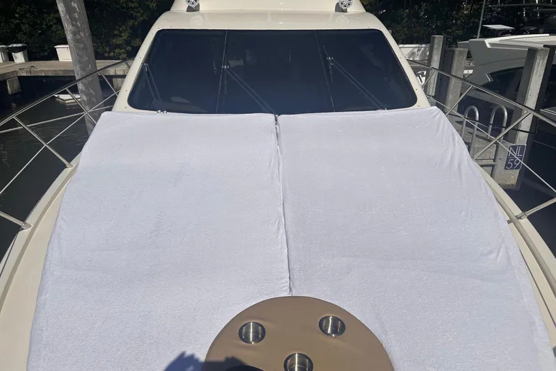 Slide: The Image of 2007 Azimut 55E yacht with sunbathing area covered in white towels. - 45