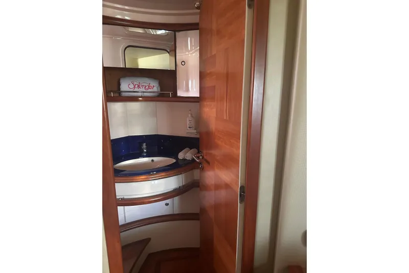 Slide: The Image of Luxurious bathroom interior of 2007 Azimut 55E yacht with wooden accents. - 52