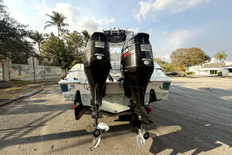Slide: The Image of 2008 Sea Fox 256 Center Console with dual Suzuki 175 engines, parked outdoors. - 5