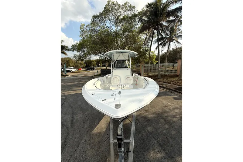 Slide: The Image of 2008 Sea Fox 256 Center Console boat on trailer, surrounded by trees and parked cars. - 9