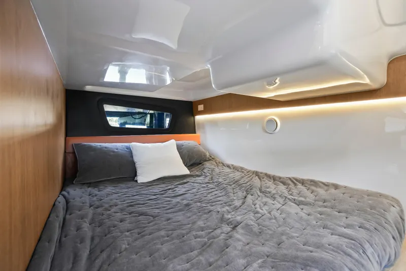 Slide: The Image of Cozy interior of 2026 Hanover 355 with plush bedding and modern design. - 12