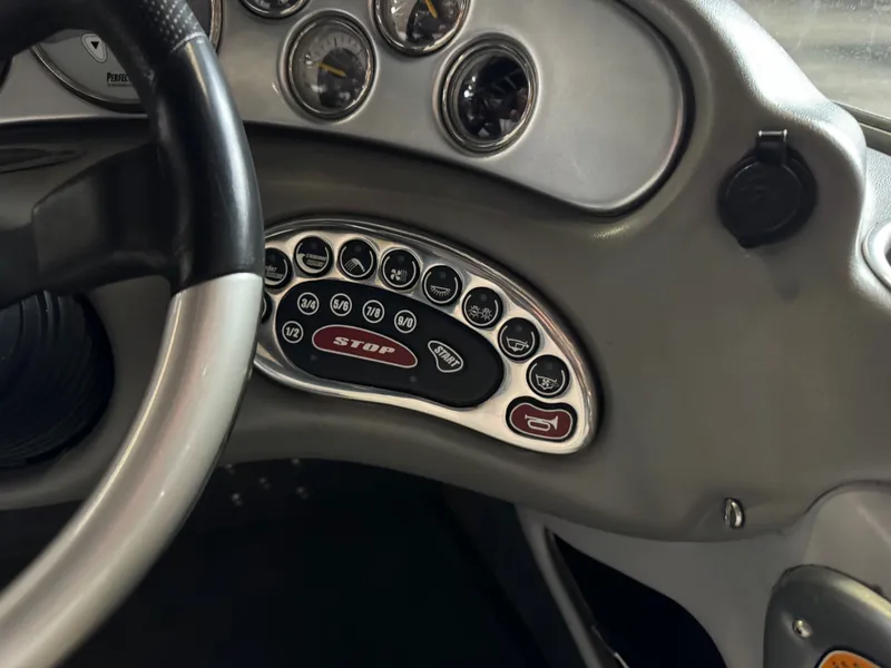 Slide: The Image of Dashboard of a 2006 Correct Craft Air Nautique 210 boat. - 11