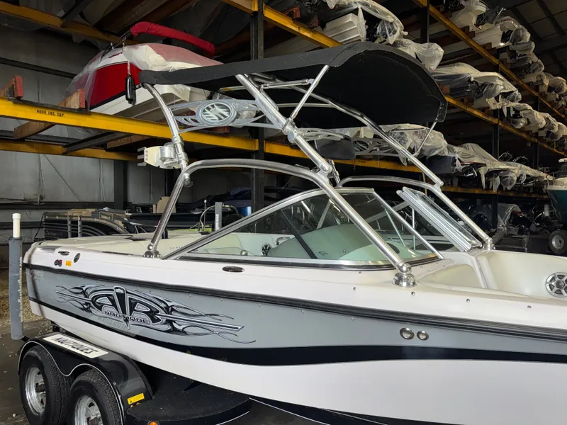 Slide: The Image of 2006 Correct Craft Air Nautique 210 boat in storage facility. - 2