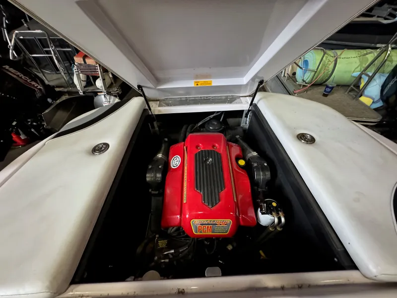 Slide: The Image of Engine compartment of a 2006 Correct Craft Air Nautique 210 boat. - 24