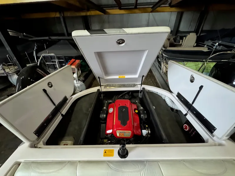 Slide: The Image of Engine compartment of a 2006 Correct Craft Air Nautique 210 boat. - 28