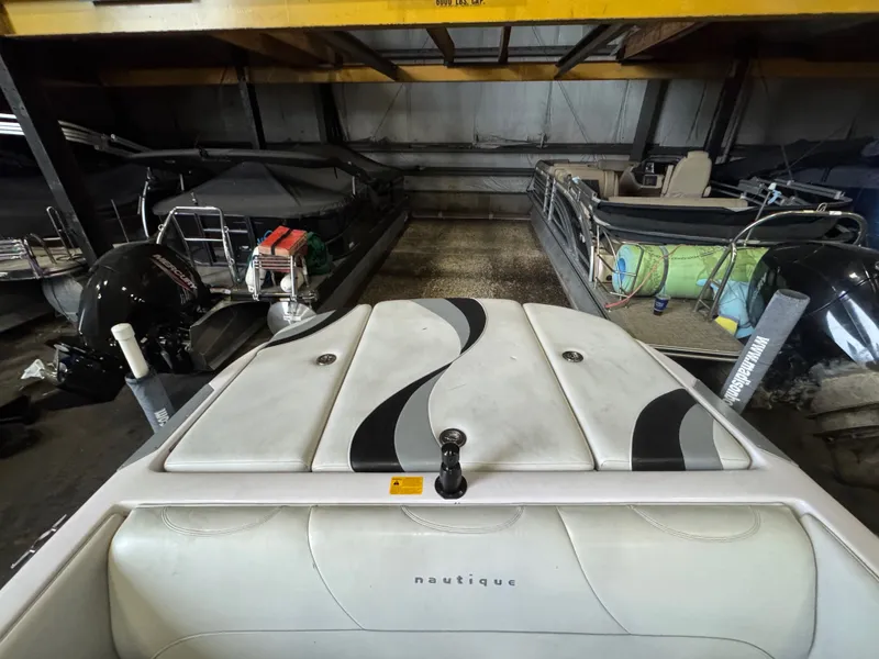 Slide: The Image of 2006 Correct Craft Air Nautique 210 in storage facility. - 29