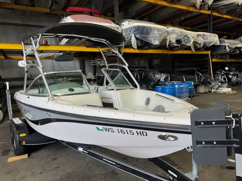 Slide: The Image of 2006 Correct Craft Air Nautique 210 in storage facility. - 3