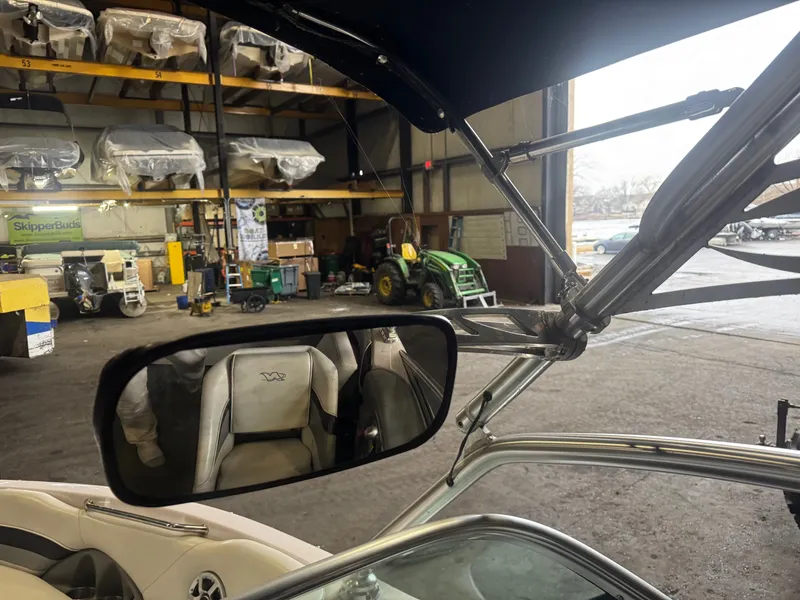 Slide: The Image of Interior view of a 2006 Correct Craft Air Nautique 210 in a storage facility. - 37