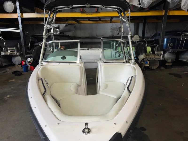 Slide: The Image of 2006 Correct Craft Air Nautique 210 boat in storage facility. - 4