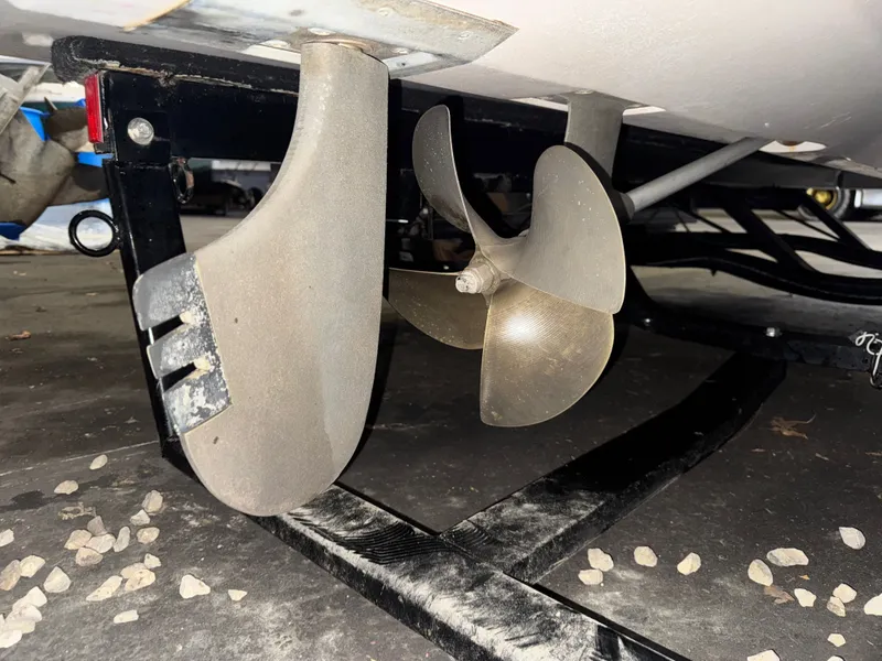 Slide: The Image of Propeller of a 2006 Correct Craft Air Nautique 210 boat on a trailer. - 40