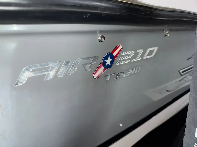 Slide: The Image of 2006 Correct Craft Air Nautique 210 boat logo close-up. - 41