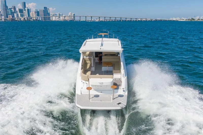 Slide: The Image of Luxury Hanover 375 yacht cruising near city skyline, 2026 model. - 16