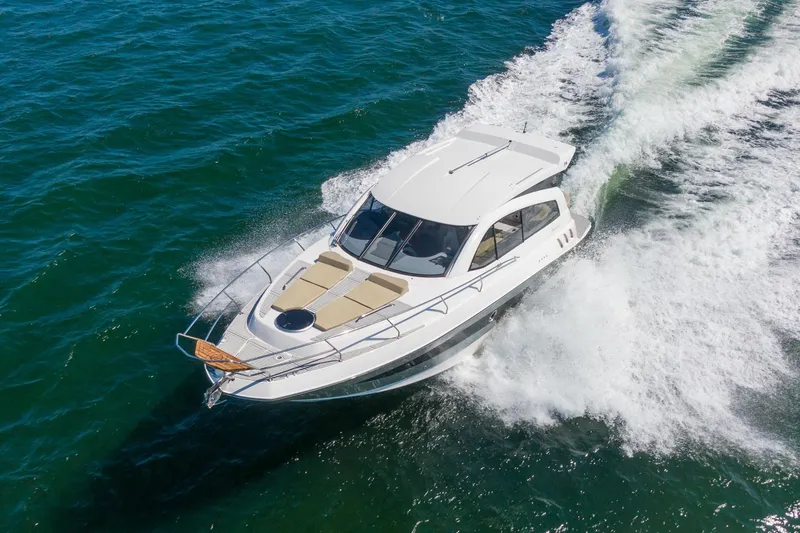 Slide: The Image of 2026 Hanover 375 yacht cruising on open water, showcasing sleek design and performance. - 17