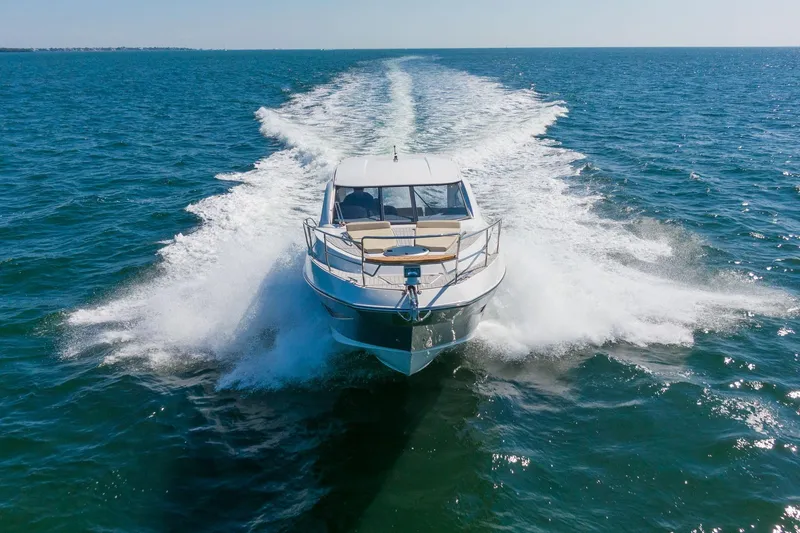 Slide: The Image of 2026 Hanover 375 yacht cruising on open sea, creating a dynamic water trail. - 18