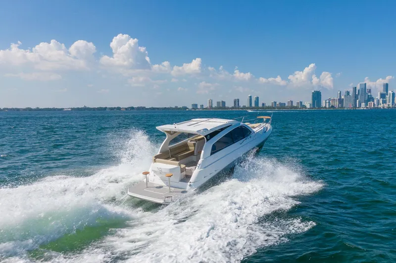 Slide: The Image of Luxury Hanover 375 yacht cruising near city skyline, 2026 model. - 19