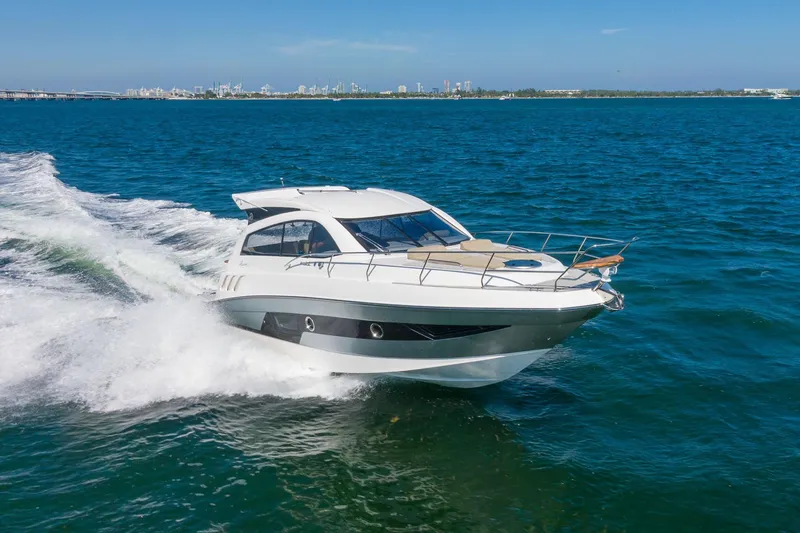 Slide: The Image of 2026 Hanover 375 yacht cruising on open blue waters. - 23