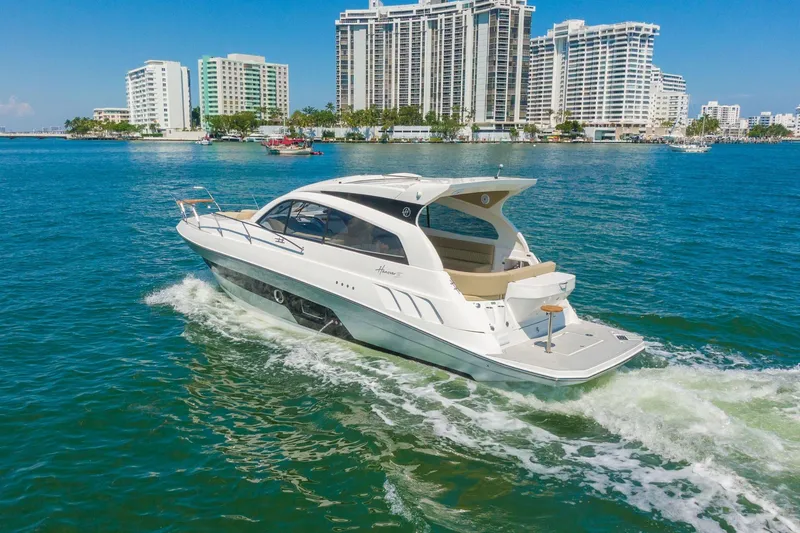 Slide: The Image of Luxury Hanover 375 yacht cruising near city skyline, 2026 model. - 28