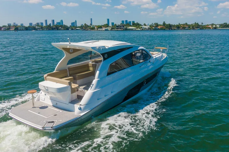 Slide: The Image of Luxurious 2026 Hanover 375 yacht cruising on a sunny day with city skyline backdrop. - 30