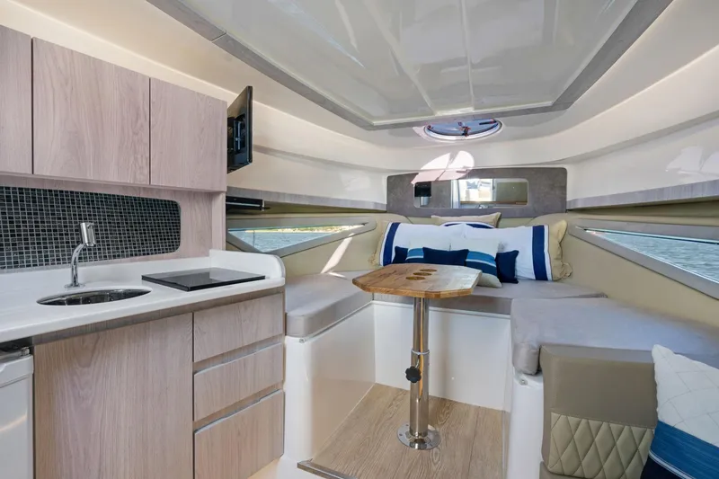 Slide: The Image of Luxurious interior of 2026 Hanover 375 yacht with modern kitchen and cozy seating area. - 38