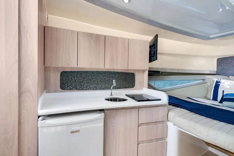 Slide: The Image of Modern Hanover 375 yacht interior with kitchenette and cozy sleeping area, 2026 model. - 42