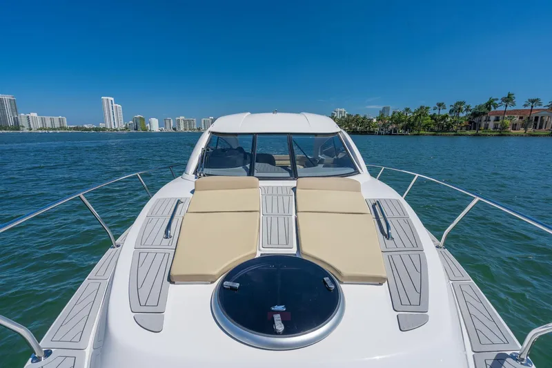 Slide: The Image of Luxury Hanover 375 yacht cruising near city skyline, 2026 model. - 65