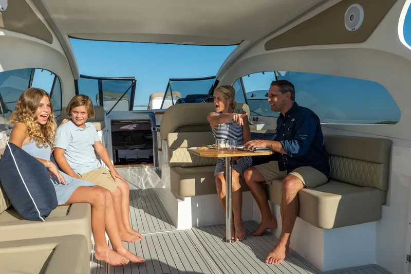 Slide: The Image of Family enjoying leisure time on a 2026 Hanover 375 yacht interior. - 81