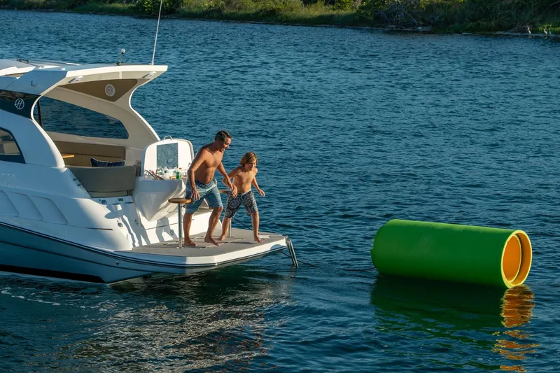 Slide: The Image of Father and child on Hanover 375 boat, 2026, enjoying water activities. - 97