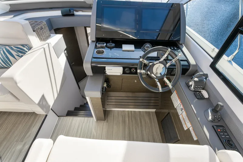Slide: The Image of 2018 Cruisers Yachts 50 Cantius helm with modern controls and sleek design. - 38
