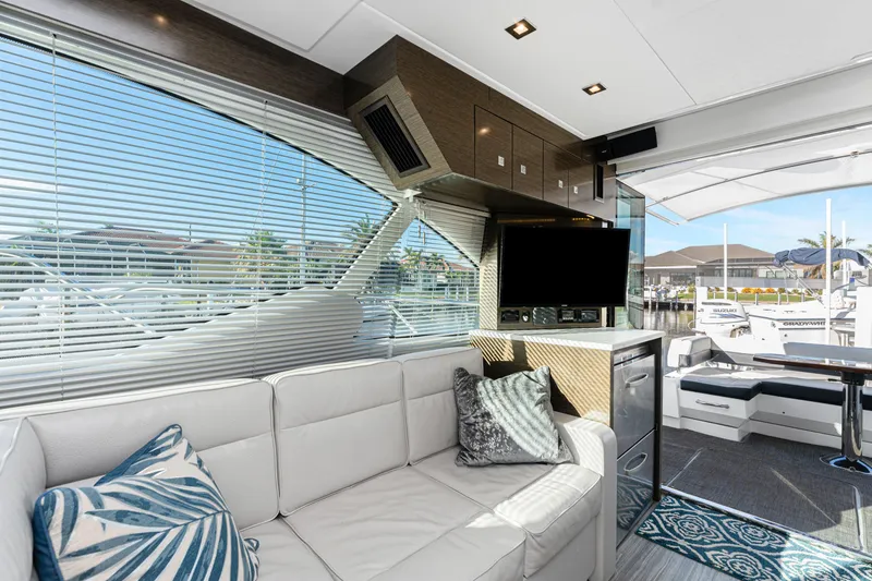 Slide: The Image of Luxurious interior of 2018 Cruisers Yachts 50 Cantius with modern decor and marina view. - 42