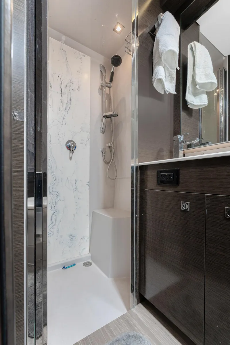 Slide: The Image of Luxurious bathroom in 2018 Cruisers Yachts 50 Cantius with modern shower and sleek cabinetry. - 10
