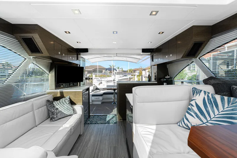 Slide: The Image of Luxurious interior of 2018 Cruisers Yachts 50 Cantius with modern seating and large windows. - 40