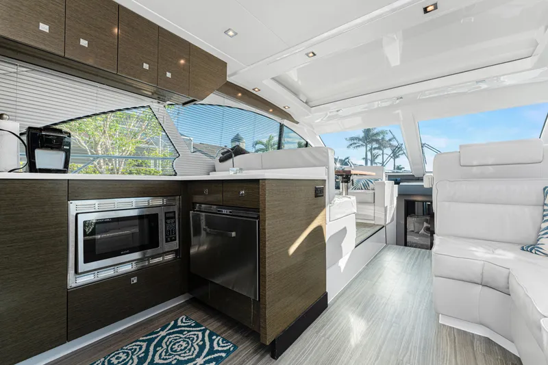 Slide: The Image of Luxurious interior of 2018 Cruisers Yachts 50 Cantius with modern kitchen and seating area. - 46