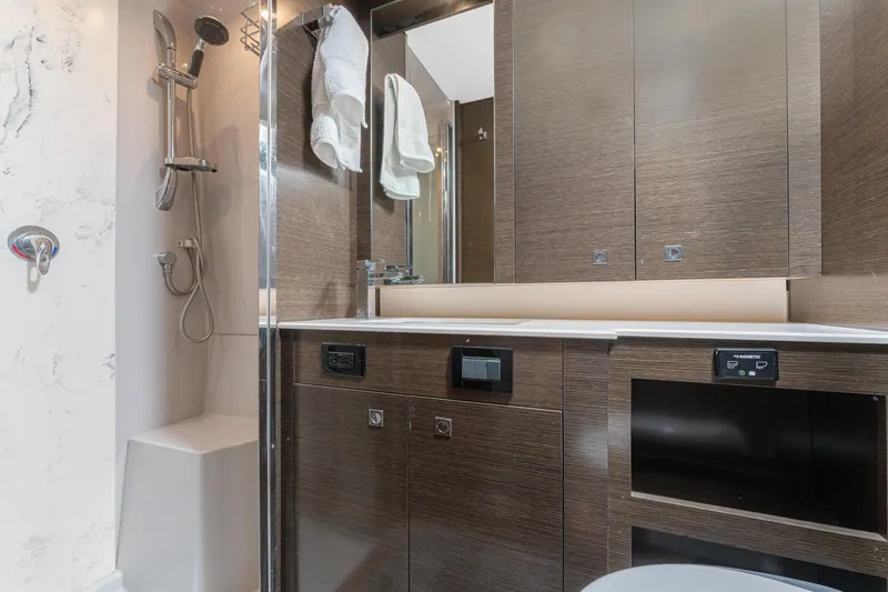 Slide: The Image of Luxurious bathroom in 2018 Cruisers Yachts 50 Cantius with modern fixtures and wood cabinetry. - 9