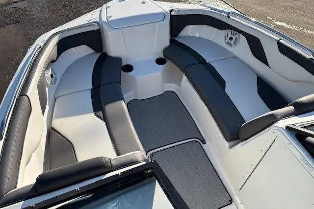 Slide: The Image of 2021 Yamaha Boats AR210 interior with spacious seating and modern design. - 6